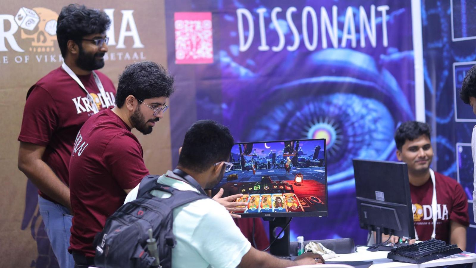 Players demoing Krodha at the !How Game Studio booth