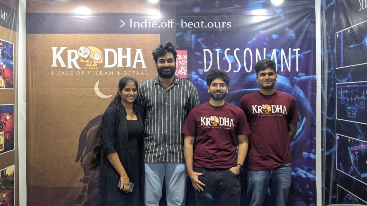 !How Game Studio team at their booth with Krodha and Dissonant banners